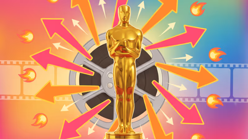 An Academy Award trophy with a blurred Hollywood red carpet background
