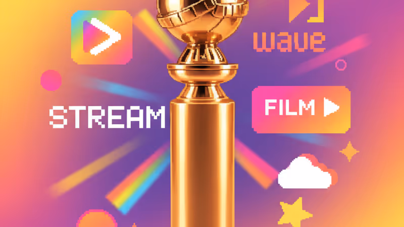 Golden Globe trophy on a pedestal under bright stage lights