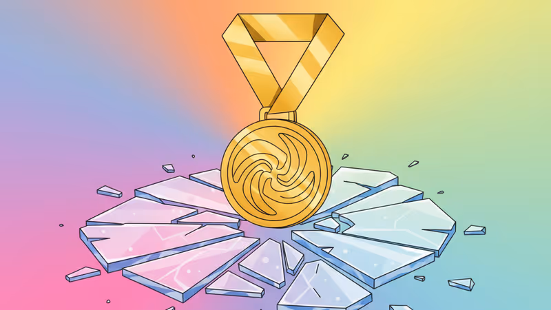 氷の上に置かれた金メダルと冬季アスリートのシルエット